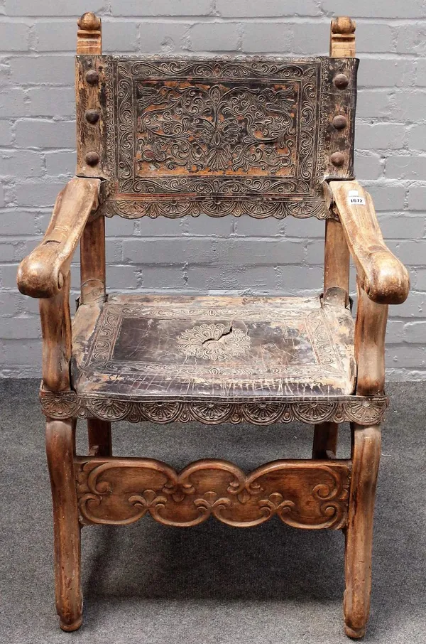 A 19th century Spanish stripped hardwood leather upholstered square back open armchair, 64cm wide x 103cm high.