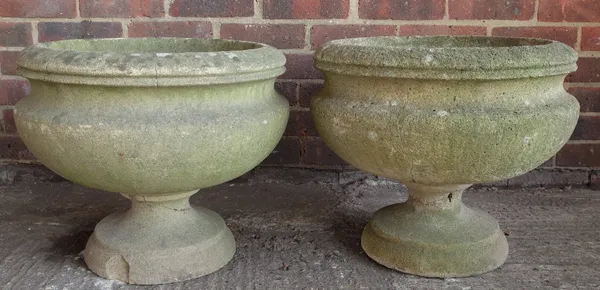 A pair of reconstituted stone circular jardinieres, on turned socles, 50cm diameter x 42cm high.