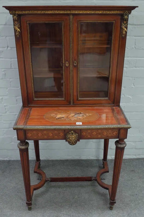 A Louis XVI style mahogany crossbanded boxwood and ebony strung marquetry and gilt metal mounted bonheur de jour, circa 1880, the raised back enclosed