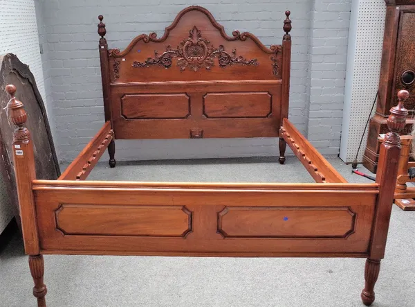 A contemporary carved mahogany rosewood banded double bed, in period style, with arched headboard, 175cm wide x 216cm deep x 146cm high.