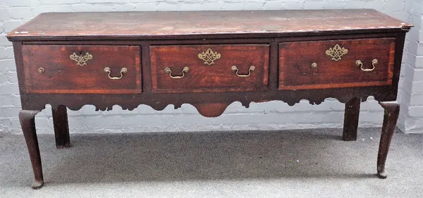 A mid-18th century crossbanded oak three drawer dresser based on turned supports, 183cm wide x 78cm high.