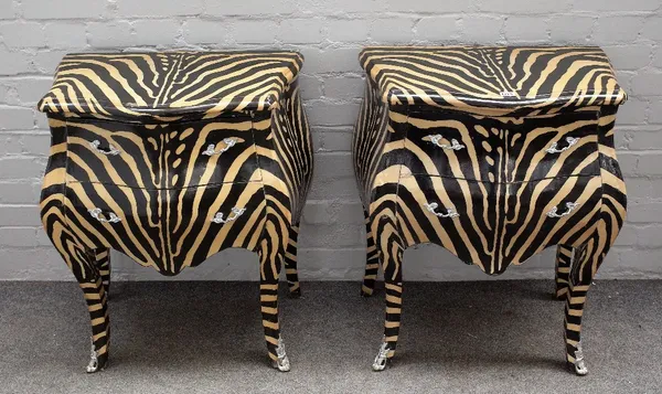 A pair of zebra print decorated bombe two drawer chests, on outswept supports, 63cm wide x 75cm high, (2).