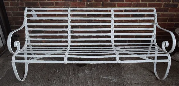 A 19th century white painted strap iron garden bench, 183cm wide x 82cm high.