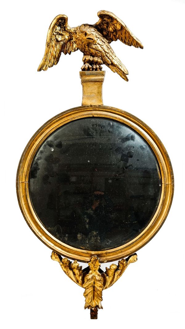 A small 19th century gilt framed convex wall mirror, with eagle surmount, 35cm wide x 67cm high.