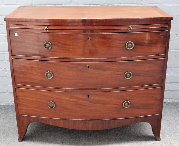 A George III mahogany bowfront chest, the brushing slide over three long graduated drawers on splayed bracket feet, 106cm wide x 91cm high.