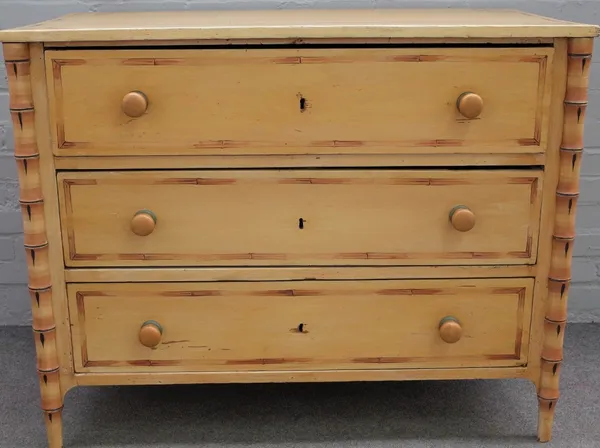 A 19th century French pine three drawer chest of drawers, with faux polychrome painted bamboo decoration, 110cm wide x 87cm high.