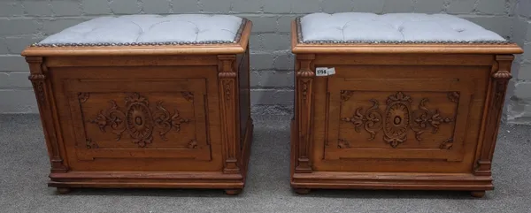 A pair of 18th century style walnut lift top box stools, with carved front panels flanked by columns, 19th century, 60cm wide x 47cm high.