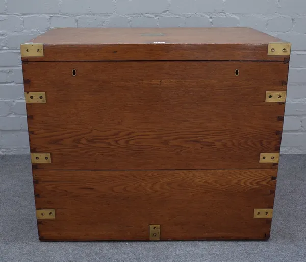 A brass bound campaign style oak rectangular strongbox, with twin locks and side handles, 77cm wide x 64cm high.