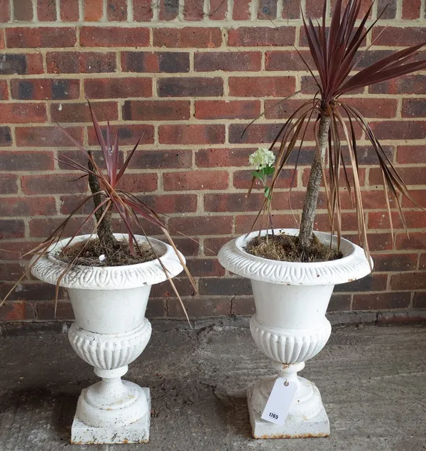 A pair of white painted cast iron garden jardinieres, with egg and dart rims and semi-fluted bodies, 40cm diameter x 50cm high.