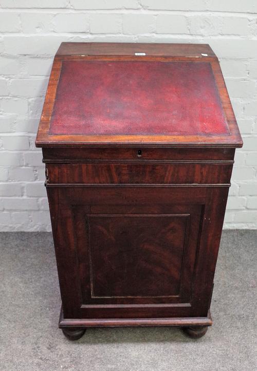 A Regency mahogany slide top Davenport, with a pair of side brushing slides over four drawers on bun feet, 51cm wide x 89cm high.