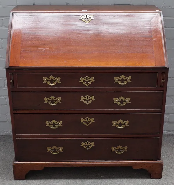 A George III mahogany bureau, the fitted interior over four long graduated drawers on bracket feet, 97cm wide x 107cm high.