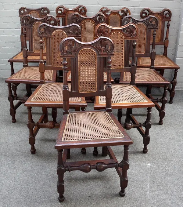 A set of twelve Victorian walnut and cane dining chairs, of 17th century Flemish design, 45cm wide x 95cm high, (12)