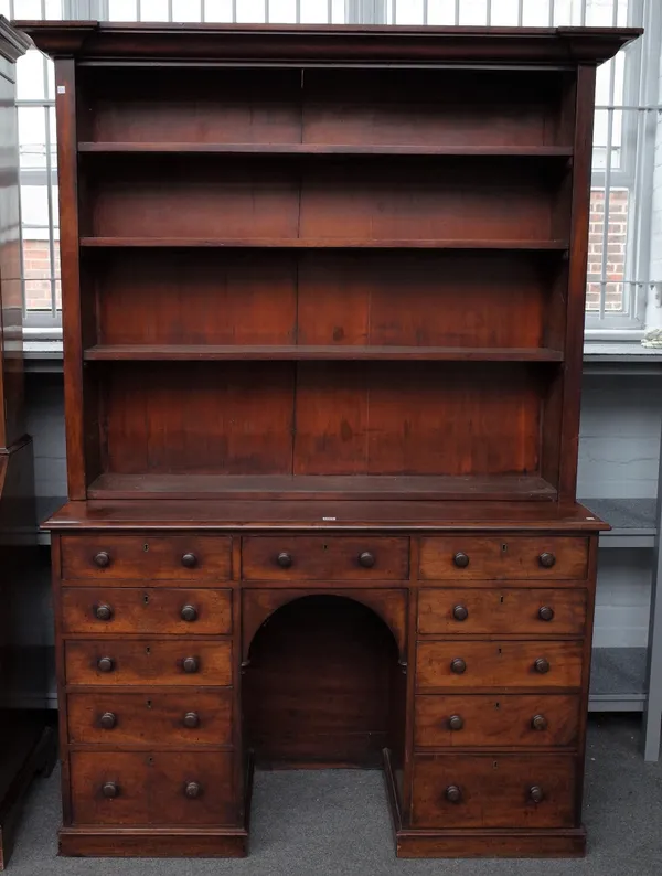 A George III mahogany dresser/writing desk, the enclosed four tier back over fitted angle adjustment writing drawer, with five drawers to either side