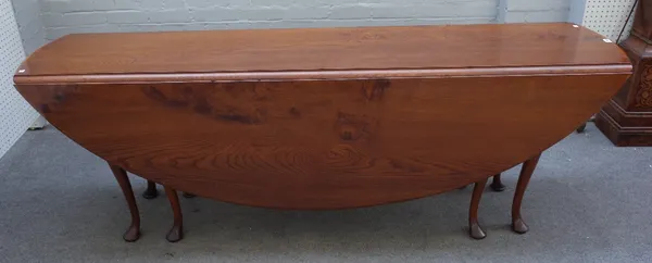 A mid-18th century style elm oval double gateleg action drop flap wake table on pad feet, 213cm long x 74cm high.