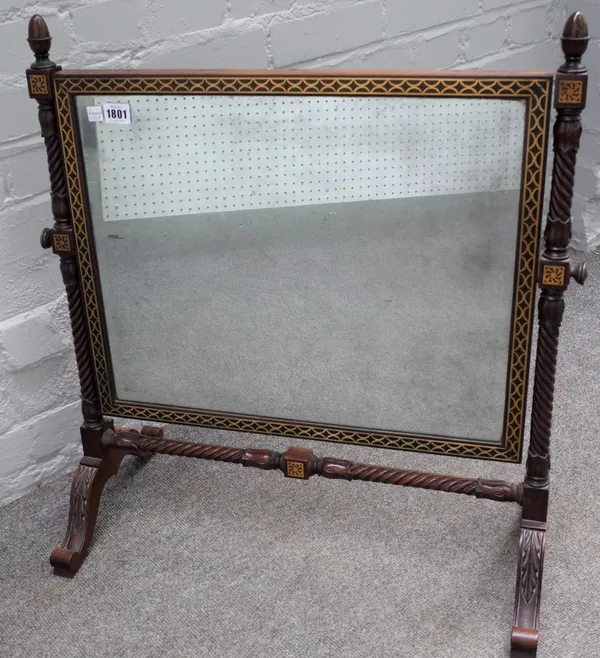 A Regency brass inlaid swing frame toilet mirror on spiral turned supports, 63cm wide x 68cm high.