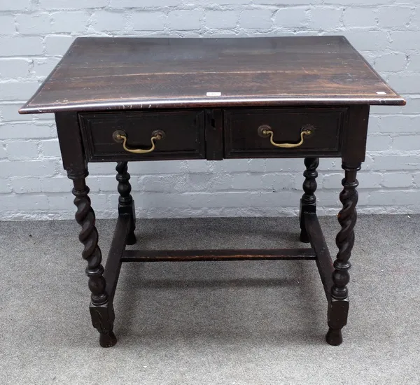 A 17th century oak single drawer side table, on barley twist supports, 87cm wide x 76cm high.