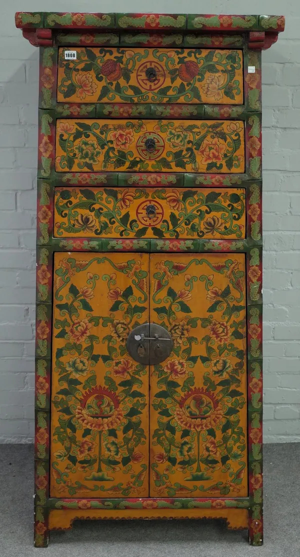 An Eastern polychrome painted tall side cabinet of tapering form, with three drawers over a pair of cupboards, 80cm wide x 170cm high.