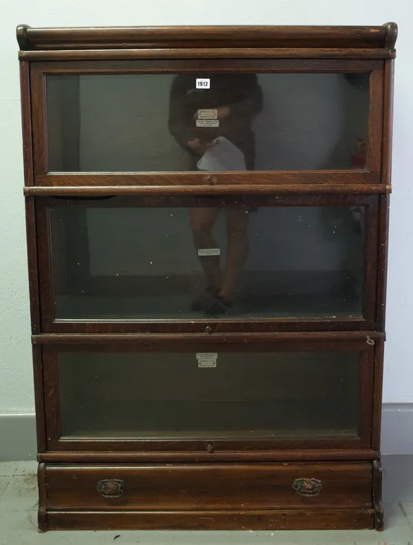 The Globe Wernicke Co Ltd; an oak three tier glass fronted bookcase, 87cm wide x 125cm high.