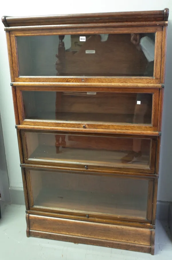 The Globe Wernicke Co Ltd; an oak four tier glass fronted bookcase, 87cm wide x 148cm high.