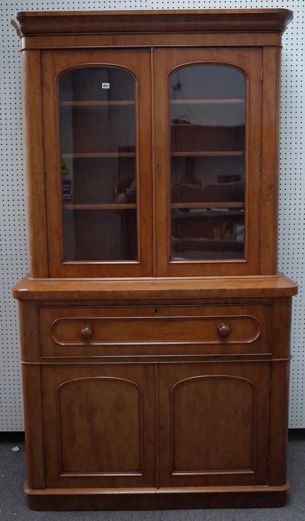 A Victorian mahogany secretaire cabinet, the pair of glazed doors over a fitted drawer and pair of cupboards, 124cm wide x 217cm high.