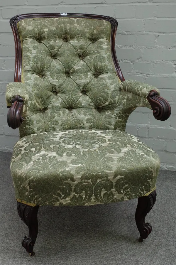 A Victorian carved mahogany framed slipper back open armchair, with scroll arms and supports, 65cm wide x 92cm high,