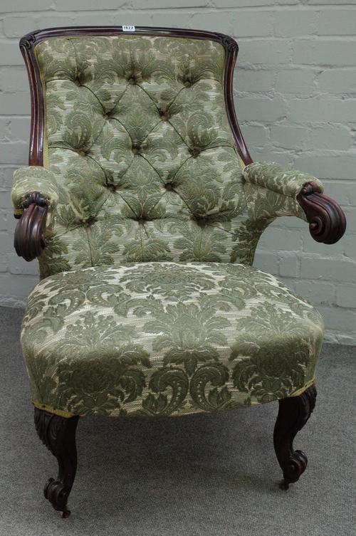 A Victorian carved mahogany framed slipper back open armchair, with scroll arms and supports, 65cm wide x 92cm high,