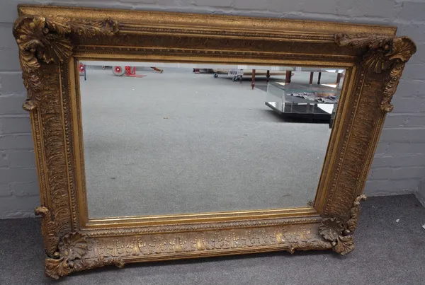 A Victorian style deep framed gilt framed mirror, with shell moulded corners, 120cm wide x 93cm high.