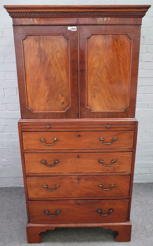 A small George III mahogany linen press, the pair of doors over four long graduated drawers, on bracket feet, 84cm wide x 175cm high.