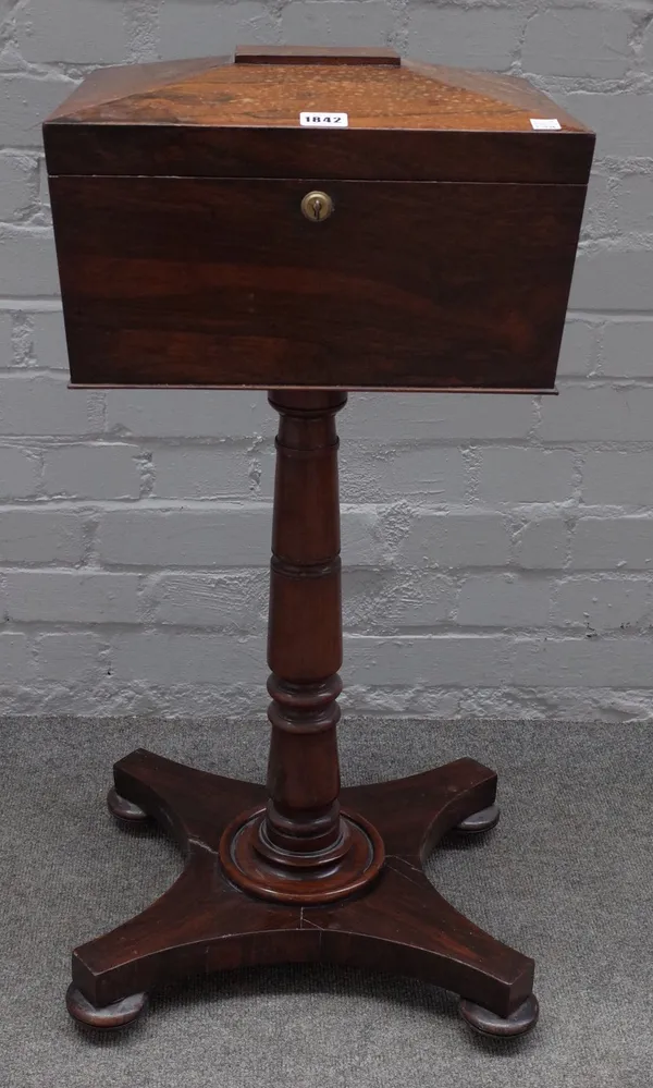 A William IV rosewood teapoy, with four canister interior on turned column and quatrefoil platform, 37cm wide x 80cm high.