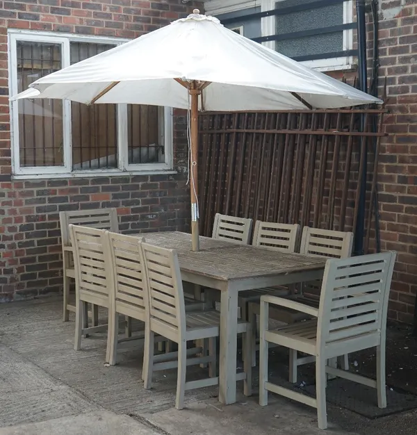 A teak rectangular garden table, 97cm wide x 203cm long, together with eight matching chairs, two with arms and parasol, (10).