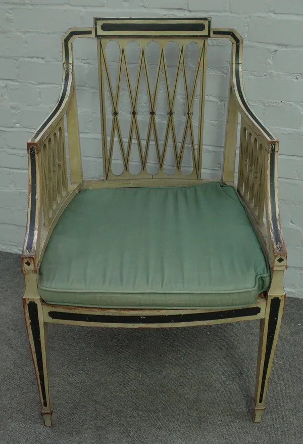 A George III green painted and ebonised armchair, with lattice back and sides on tapering square supports, 55cm wide x 89cm high.