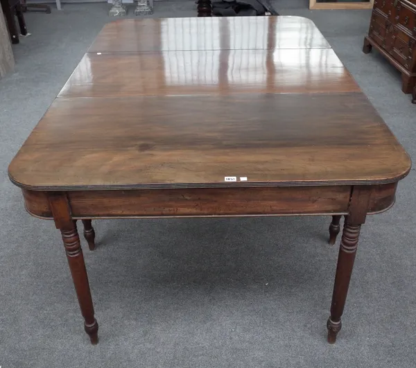 A Regency mahogany 'D' end extending dining table on turned supports, one extra leaf, 118cm wide x 124cm long x 177cm long extended.