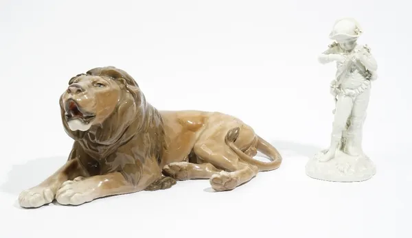 A Royal Copenhagen white glazed porcelain figure representing Autumn,  early 20th century, modelled as a youth holding bunches of grapes, various mark