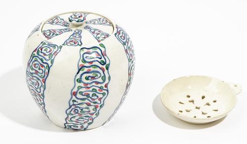 A Wedgwood earthenware oviform jar and cover designed by Louise Powell, circa 1930, painted with stylised vertical bands, 12.5cm high, impressed Wedg