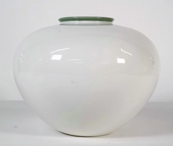 A KPM Berlin white glazed porcelain vase, 20th century, probably designed by Trude Petri, of compressed globular form with celadon green glazed rim, b