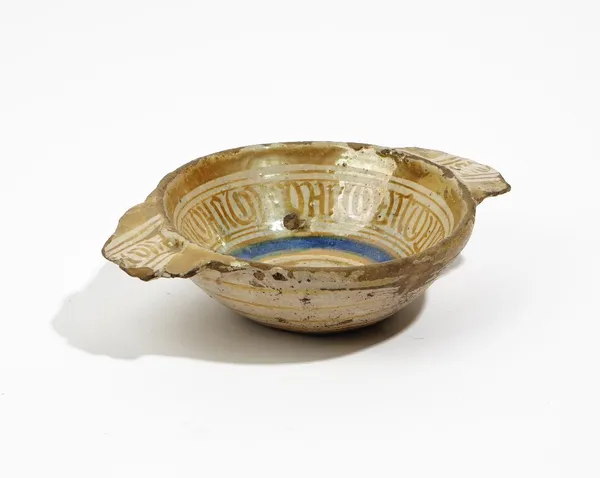 An Hispano Moresque small two-handled bowl ( scudella), probably 15th/16th century, decorated with blue and gold lustre bands, 20cm. wide across handl