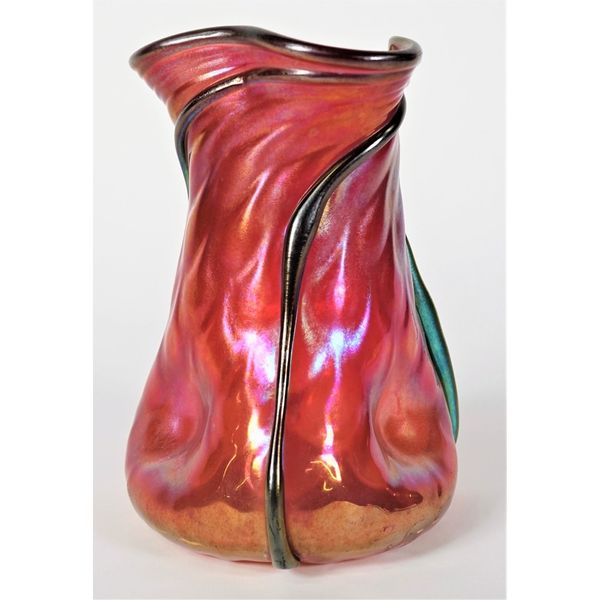 An Austrian Loetz glass vase, circa 1900, opalescent red with applied trailing detail against a triform body, 18cm high.