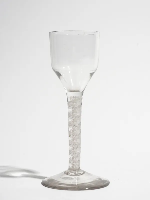 An opaque twist wine glass, circa 1765, the ogee bowl raised on a double-series opaque twist stem and plain foot, 14.75cm. high.