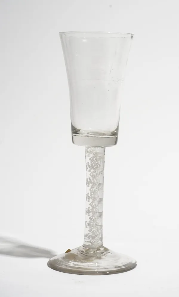 An opaque twist wine glass, circa 1765, the waisted bucket bowl raised on a double-series opaque twist stem and plain foot, 17.25cm. high.