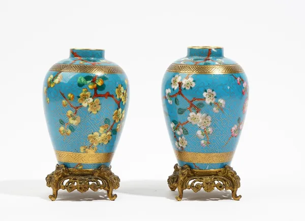 A pair of small French porcelain turquoise-ground ovoid vases, late 19th century, in cloisonné style, each painted with a bird amongst flowering branc