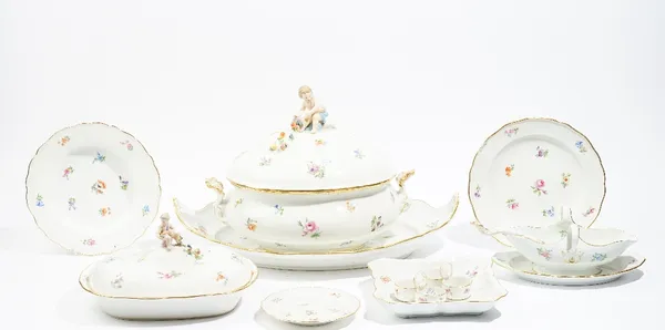 A Meissen porcelain part dinner service, circa 1880, each piece painted with scattered flowers inside a gilt-edged wavy rim, comprising; an oval soup