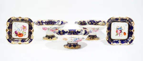 Two Ridgway footed oval bowls and two square dishes, circa 1825, each piece well painted with flower groups against a deep blue ground enriched in gil