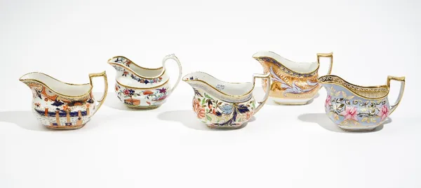 A group of five Ridgway porcelain cream jugs, circa 1815-20, each of oblong form, various floral and foliate patterns, pattern numbers 2/5, 2/702, 2/1