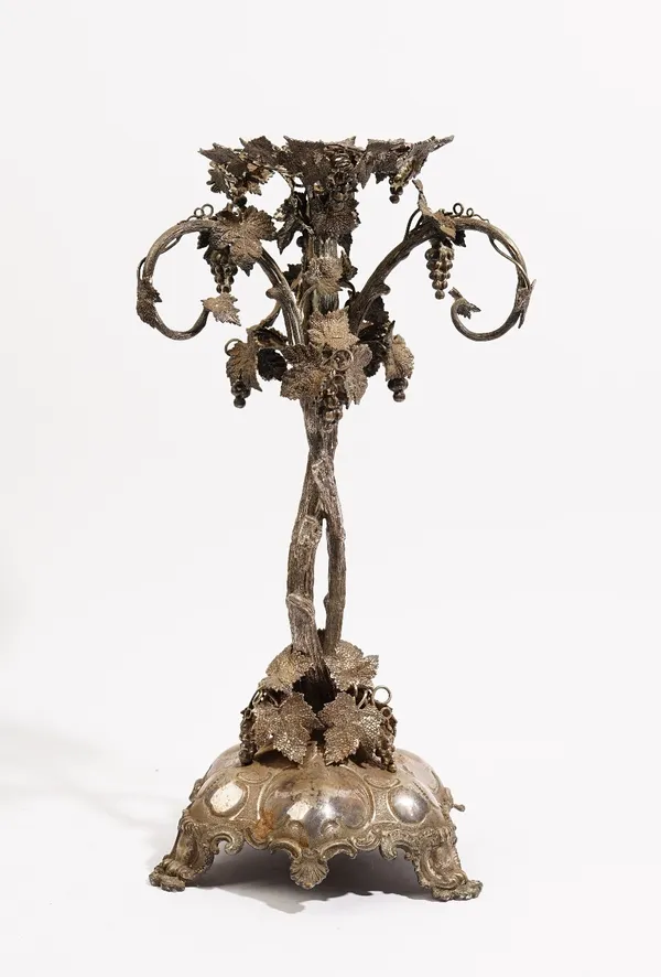 A Victorian plated centrepiece stand, of rustic form, designed as fruiting vine, raised on a triform base (the centre bowl and three hanging baskets l