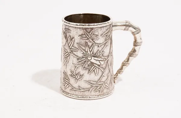 A Chinese mug of tapered cylindrical form, decorated with bamboo below raised rims and with a simulated bamboo handle, marked KHC for Khecheong, Canto