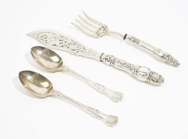 Silver, comprising: a pair of Victorian fish servers, with pierced and engraved decoration and with loaded handles, Sheffield 1855 and a pair of king'