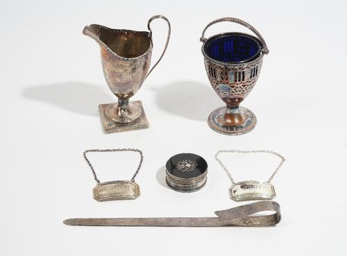 Silver and silver mounted wares, comprising; a ruler, Birmingham 1910, a helmet shaped cream jug, London 1794, a circular box and cover with inlaid to
