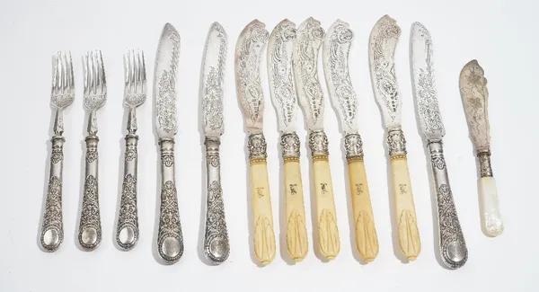 Five Victorian silver bladed fish knives, having engraved decoration and with carved ivory handles, Birmingham 1871, three pairs of plated dessert kni