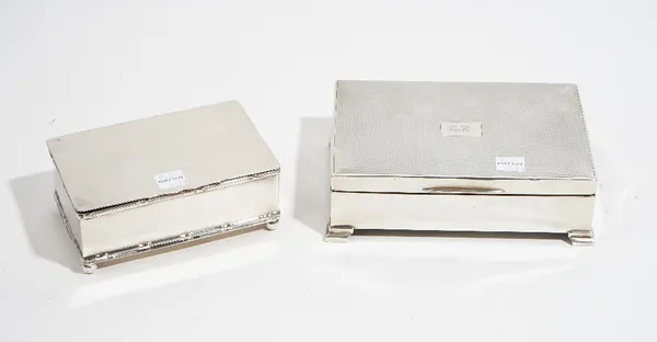 A silver mounted rectangular table cigarette box, wooden lined within, the hinged lid initial engraved, otherwise engine turned, the sides plain, rais