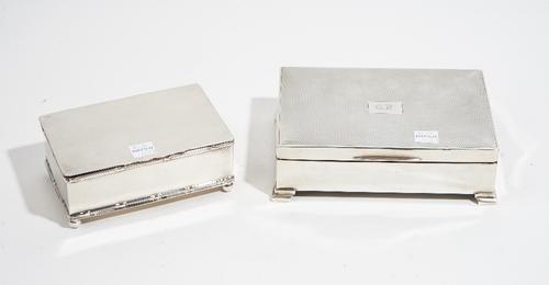 A silver mounted rectangular table cigarette box, wooden lined within, the hinged lid initial engraved, otherwise engine turned, the sides plain, rais